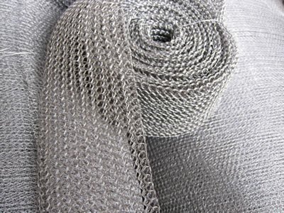 A roll of knitted wire mesh with multi-filament.