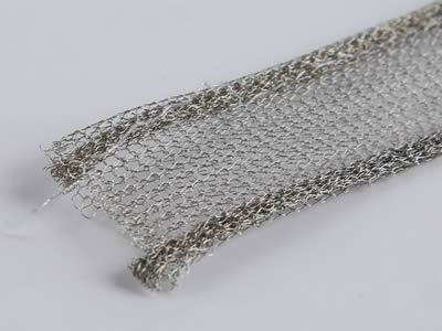 A double round knitted wire mesh gaskets on the gray background.