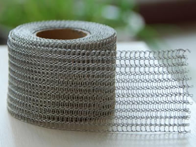 A roll of knitted wire mesh in flatten type.
