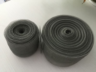 Two rolls of stainless steel knitted wire mesh with different lengths.