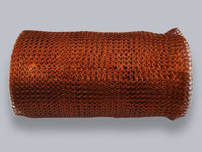 A roll of copper knitted wire mesh on the white background.