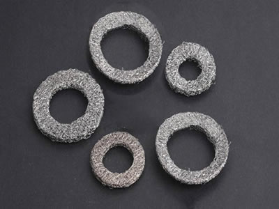 Five circle shape knitted wire mufflers on the black background.