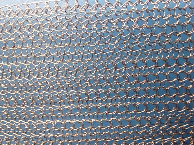 A piece of mono-filament stainless steel knitted mesh.